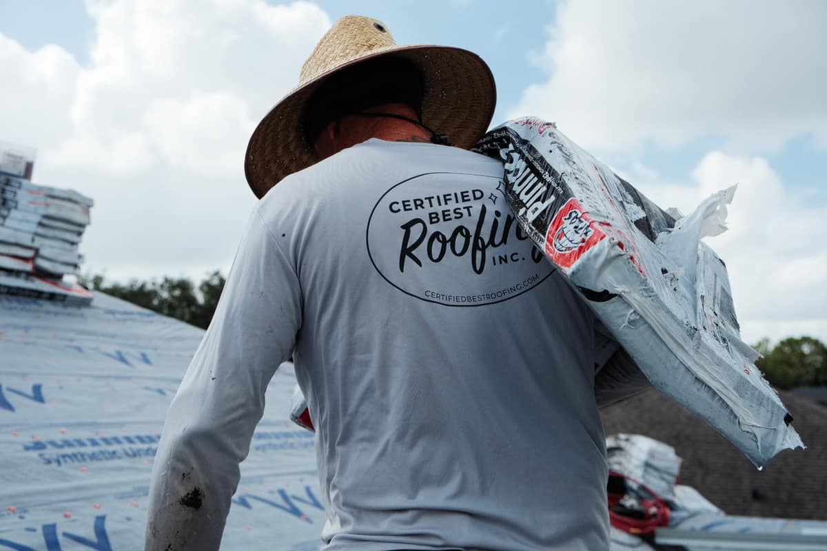 Roofer tracing and repairing a roof leak on a Florida home