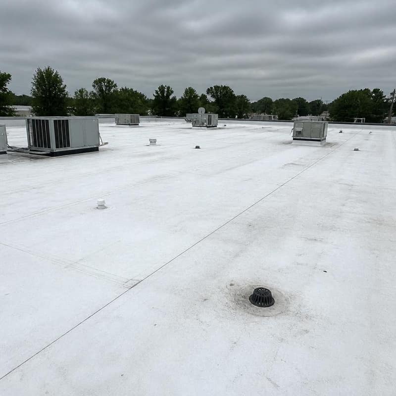 Commercial white TPO flat roof with rooftop HVAC units on a Central Florida building